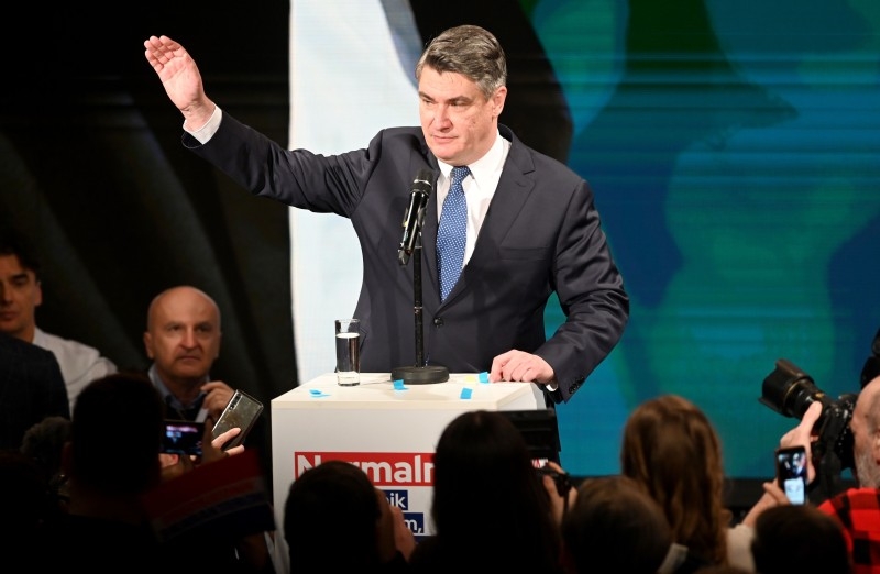 Presidential candidate of Social Democratic Party Zoran Milanovic gestures as he gives a speech after the first results of the Croatian presidential elections' first round on Sunday in Zagreb. -AFP