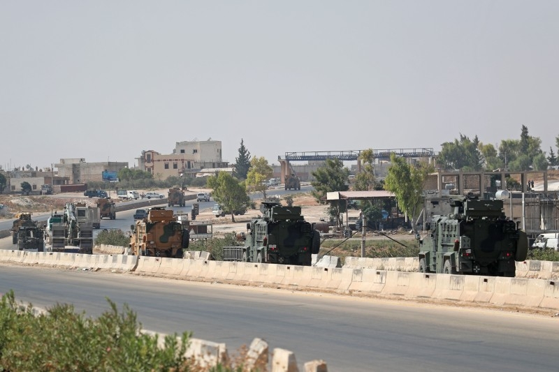  In this file photo taken on September 12, 2019, a Turkish military convoy heads towards an observation point near the town of Maar Hitat in Syria's northern Idlib province. -AFP