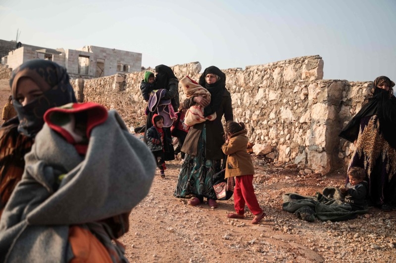  In this file photo taken on September 12, 2019, a Turkish military convoy heads towards an observation point near the town of Maar Hitat in Syria's northern Idlib province. -AFP