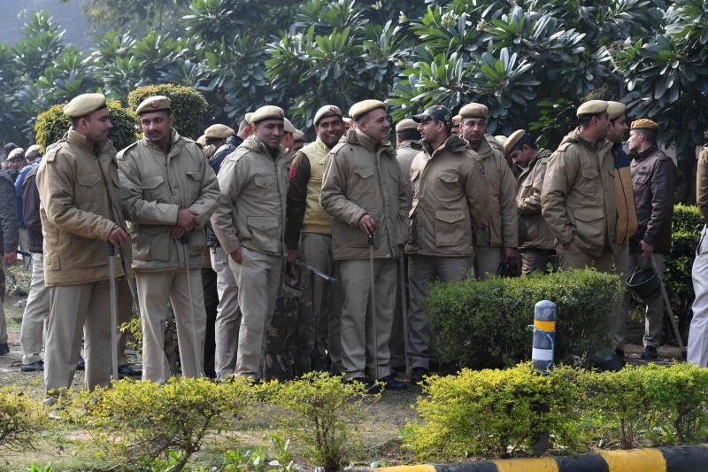 Police gather at a protest against India's new citizenship law in New Delhi on Tuesday. — AFP
