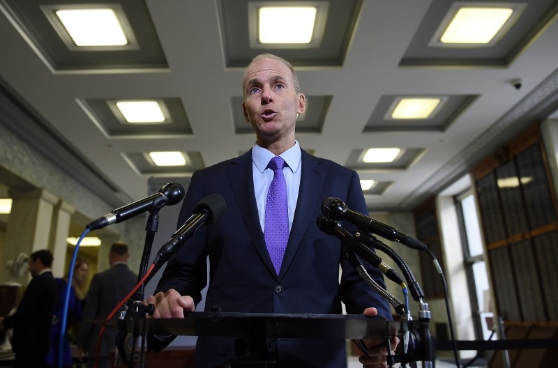  In this file photo taken on October 30, 2019 Boeing CEO Dennis Muilenburg makes a statement to the media before testifying at a hearing in front of a congressional lawmakers on Capitol Hill in Washington, DC on. Boeing on December 23, 2019 replaced its embattled chief executive, Dennis Muilenburg, saying a change was needed as it attempts to restore its reputation amid the protracted 737 MAX crisis. -AFP