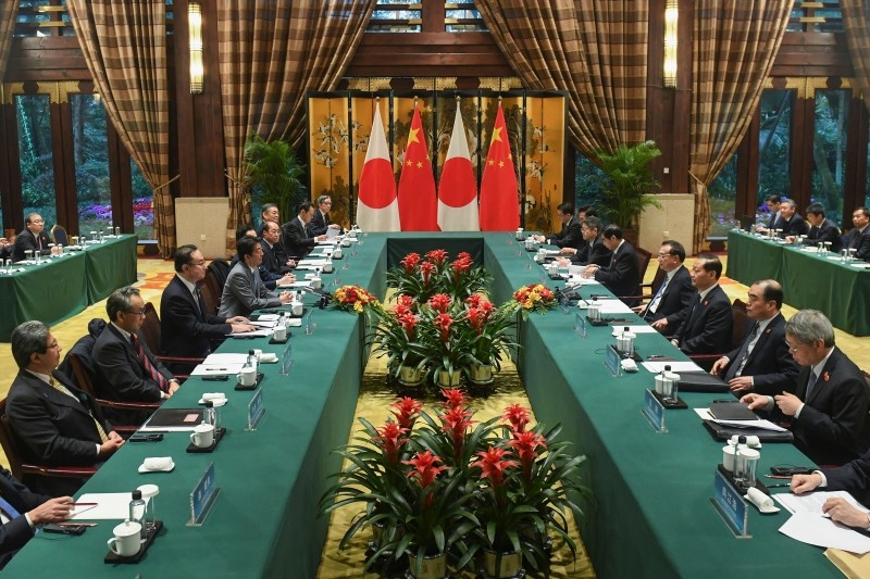 China's Premier Li Keqiang, fourth right, and Japan's Prime Minister Shinzo Abe, fourth left, attend a bilateral meeting during the 8th trilateral leaders' meeting between China, South Korea and Japan in Dujiangyan, in southwest China's Sichuan province, on Wednesday. — AFP