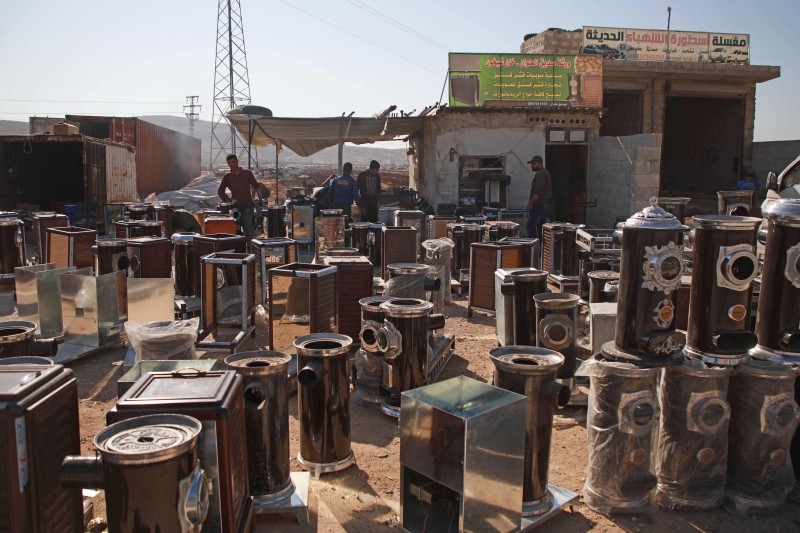 Pistachio-powered heaters are displayed for sale along a street in Al-Dana town in Syria's northwestern province of Idlib in this Dec. 18, 2019 file photo. — AFP