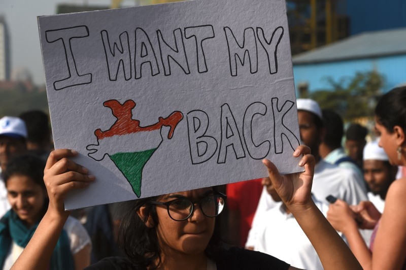 Students protest as they hold placards and shout slogans during a demonstration against India's new citizenship law in Amritsar on Friday. Mobile Internet was cut in parts of India's most populous state and thousands of riot police were deployed as authorities readied for fresh protests over a citizenship law seen as anti-Muslim. — AFP