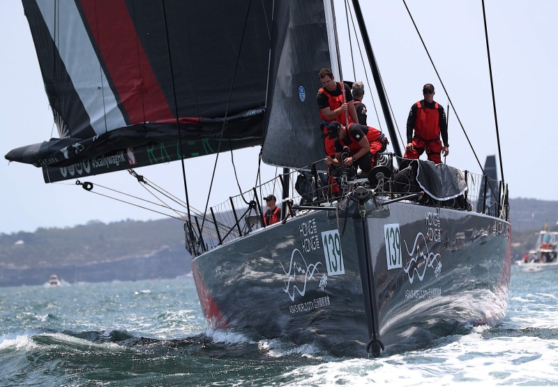 Photo shows Hong Kong Dovell 100 yacht SHK Scallywag sailing out of Sydney harbor at the start of the Sydney to Hobart yacht race on Friday. — AFP