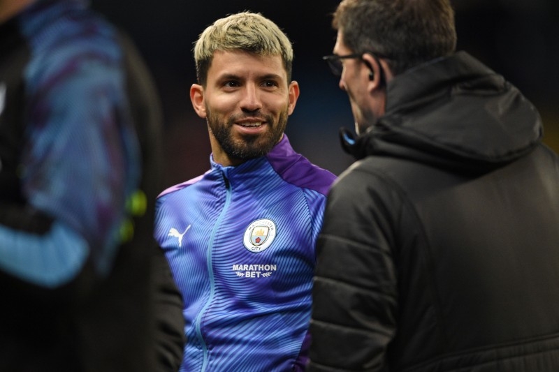 Manchester City's Argentinian striker Sergio Aguero, on the bench for the game, warms up ahead of the English Premier League football match between Manchester City and Leicester City at the Etihad Stadium in Manchester, north west England, on Dec. 21, 2019. — AFP