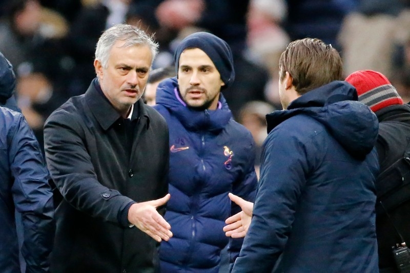 Tottenham Hotspur's Portuguese head coach Jose Mourinho (L) shakes hands with Brighton's English manager Graham Potter during the English Premier League football match   at Tottenham Hotspur Stadium in London, on Thursday. — AFP