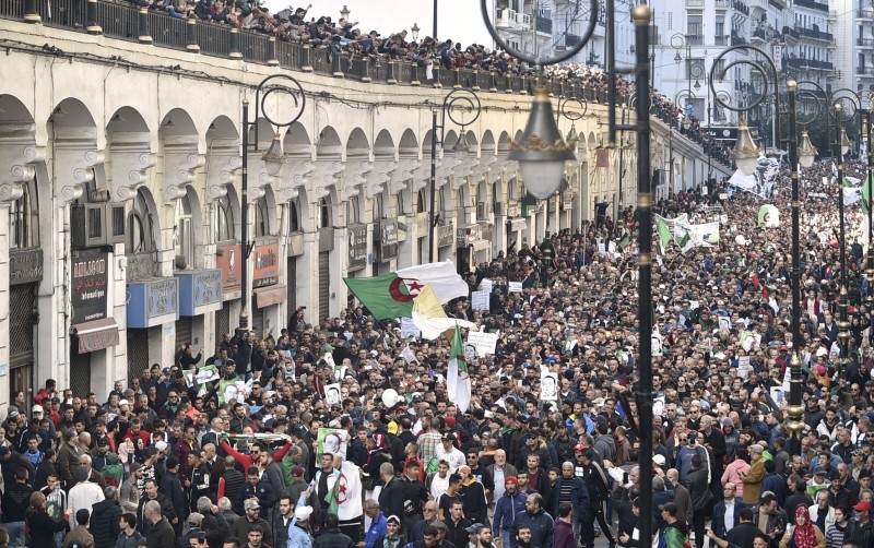 Algerian protesters take part in an anti-government demonstration in the capital Algiers on Friday. — AFP