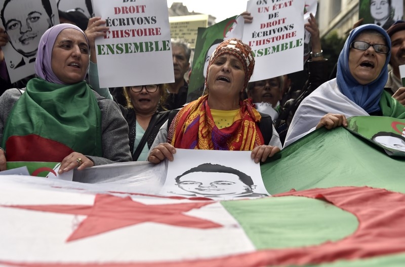 Algerian protesters take part in an anti-government demonstration in the capital Algiers on Friday. — AFP