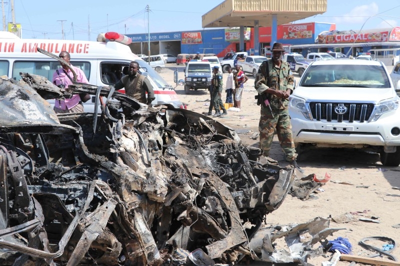 A minibus that was damaged during a car bomb that exploded in Mogadishu that killed more than 20 people is seen in Mogadishu on Saturday. -AFP