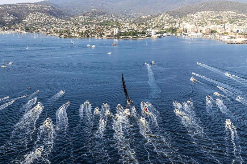 This handout photo taken and released on Saturay by Rolex shows US supermaxi yacht Comanche heading to Hobart to claim line honors victory at the Sydney to Hobart yacht race. — AFP