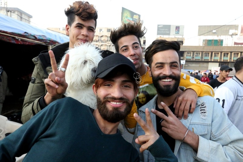 Iraqi anti-government demonstrators sporting a pompadour hairstyle pose at Tahrir Square in central Baghdad on Dec. 23, 2019. Since the start of Iraq's anti-government protests on Oct. 1, one thing strikes the eye perhaps above all else — the unbridled hairstyles young men sport. High quiffs, tight fades and loads of attitude — it is quite the male beauty pageant. — AFP