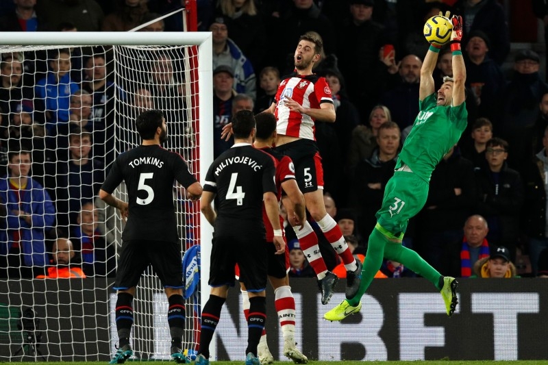 Crystal Palace's Spanish goalkeeper Vicente Guaita (R) saves a cross during the English Premier League football match between Southampton and Crystal Palace at St Mary's Stadium in Southampton, southern England on Saturday. — AFP
