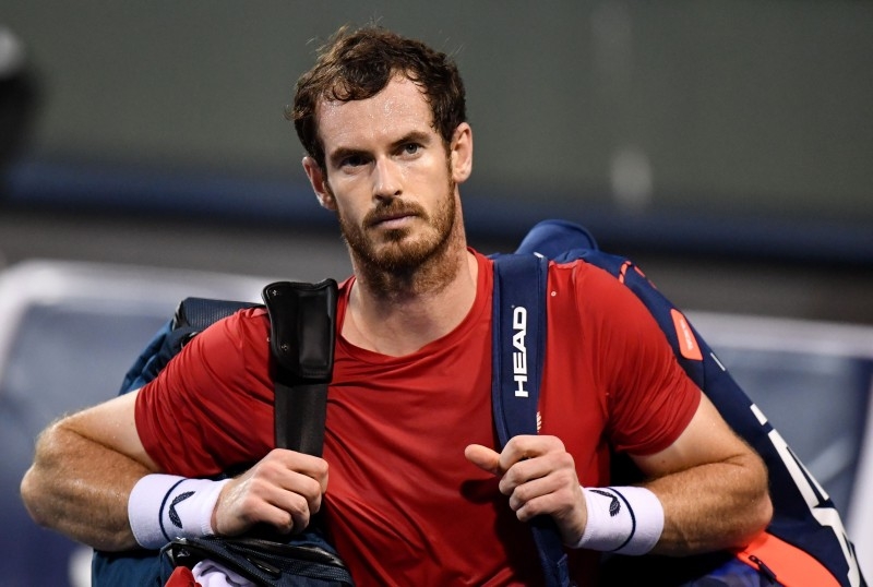 In this file photo Andy Murray of Britain leaves the court after losing against Fabio Fognini of Italy in their men's singles match at the Shanghai Masters tennis tournament in Shanghai on Oct. 8, 2019. Andy Murray has been ruled out of next month's Australian Open with a pelvic injury, it was announced  on Saturday. — AFP