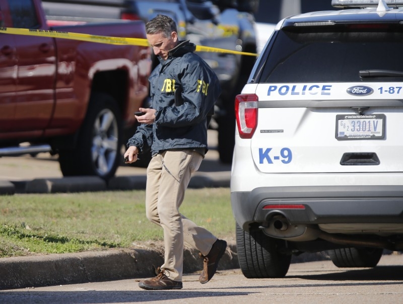 An FBI agent works the scene after a shooting took place during services at West Freeway Church of Christ on Sunday in White Settlement, Texas. -AFP