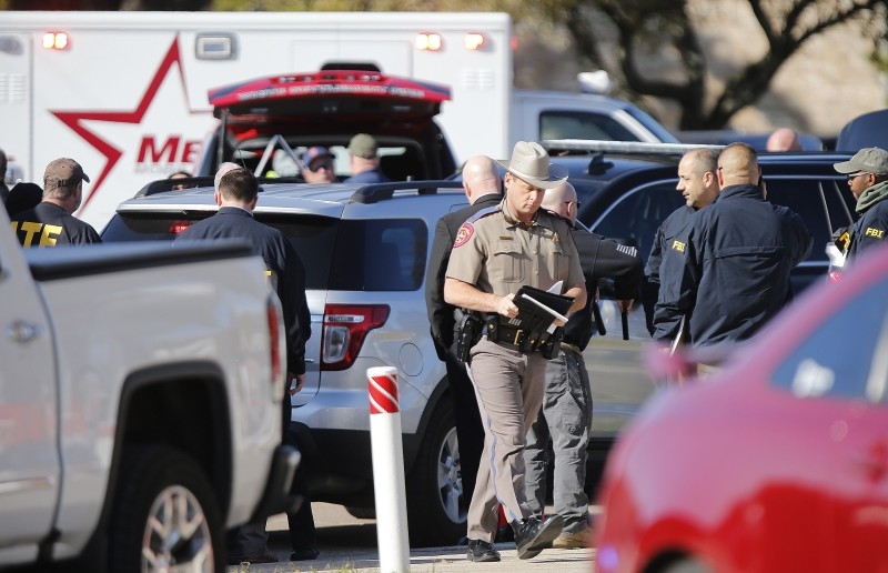 An FBI agent works the scene after a shooting took place during services at West Freeway Church of Christ on Sunday in White Settlement, Texas. -AFP