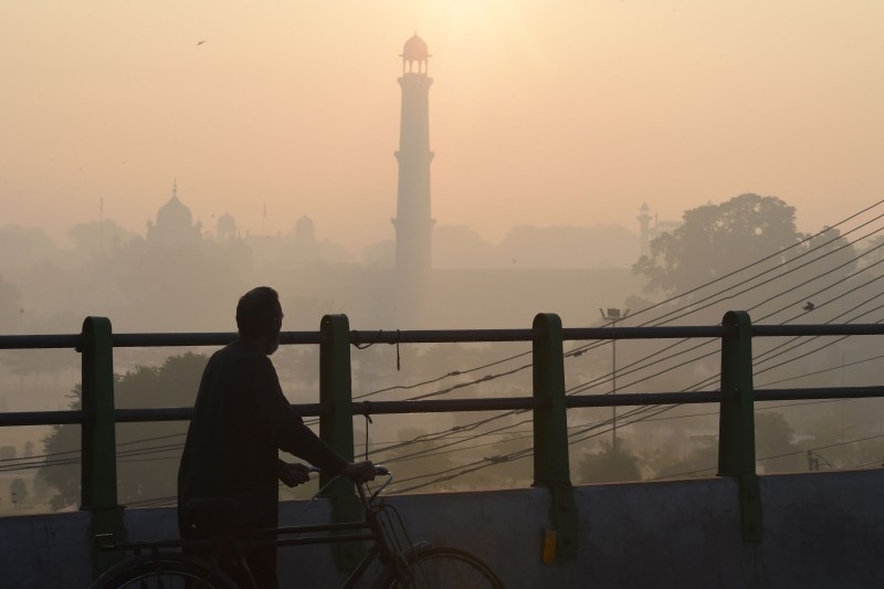 This picture taken on December 6, 2019 shows heavy smog conditions around Badshahi Mosque in Lahore. -AFP