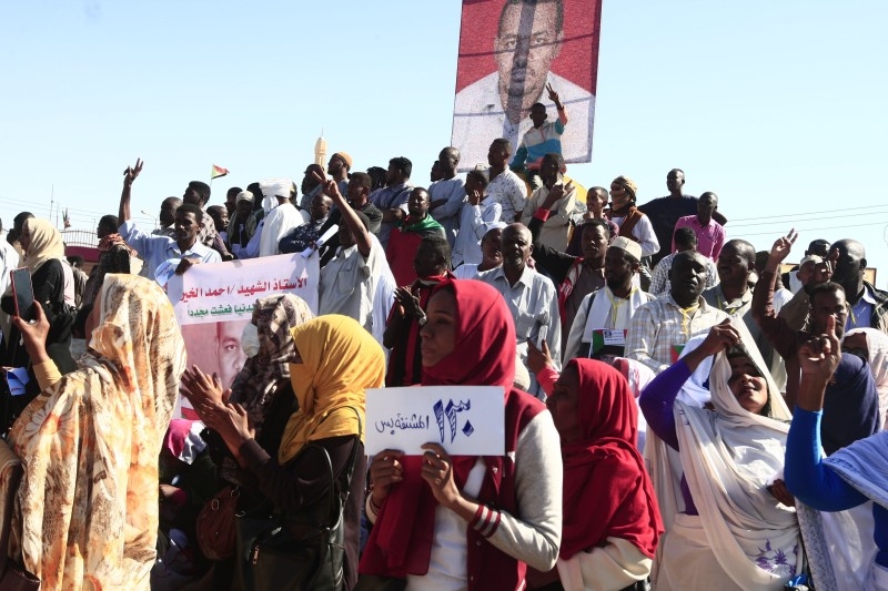 Sudanese protesters rally in front of a court in Omdurman near the capital Khartoum during the trial on Monday of intelligence agents for the death of teacher Ahmed Al-Khair  while in custody of intelligence services. -AFP