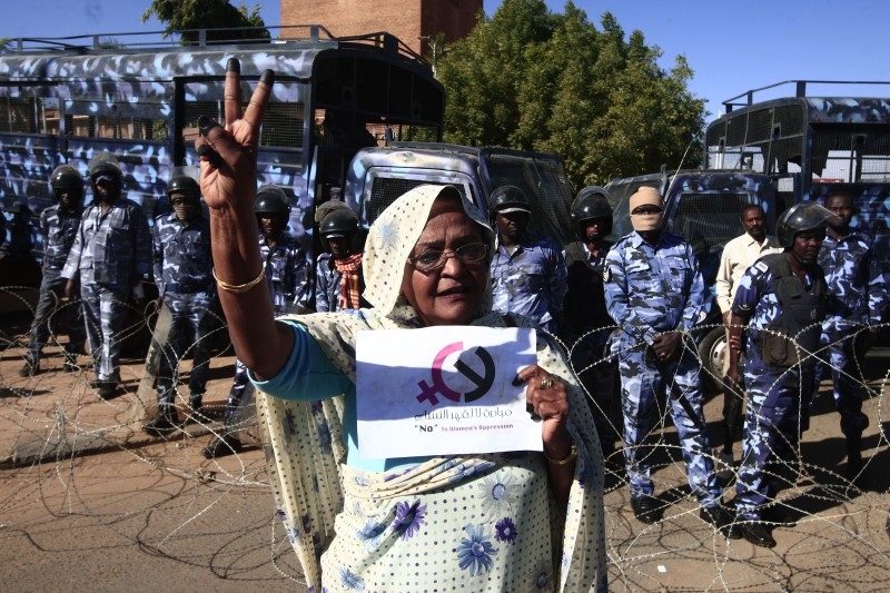 Sudanese protesters rally in front of a court in Omdurman near the capital Khartoum during the trial on Monday of intelligence agents for the death of teacher Ahmed Al-Khair  while in custody of intelligence services. -AFP