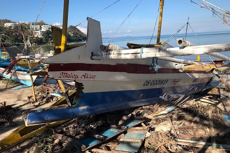 This photo shows a boat damaged by Typhoon Phanfone, on Bulabog beach on the Philippine island of Boracay on December 26, 2019. -AFP 