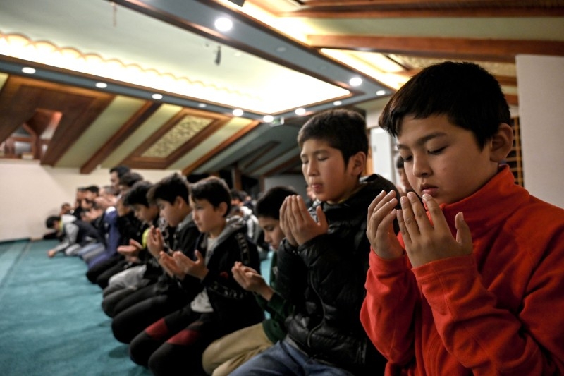 Uighur students pray after lessons on November 29, 2019 at Silivri district in Istanbul. -AFP