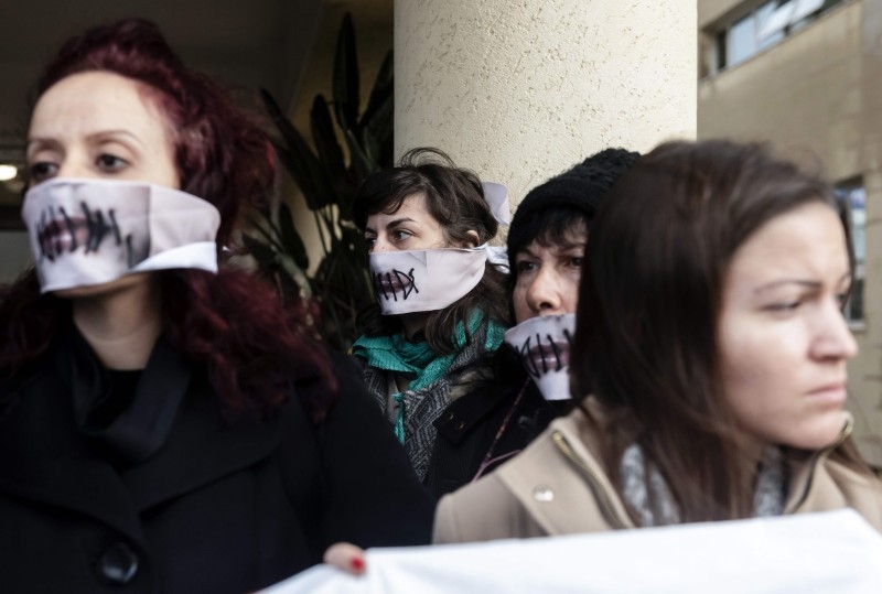 Women's rights activists stage a protest in support of a British teenager accused of falsely claiming she was raped by Israeli tourists, during her trial at the Famagusta District Court in Paralimni in eastern Cyprus, on Monday. — AFP