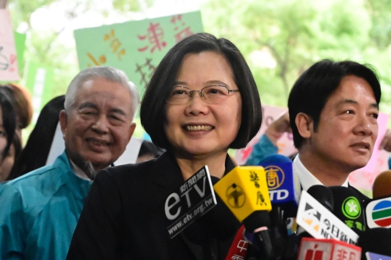 Taiwan's President Tsai Ing-wen, center, speaks after registering as a presidential candidate outside the Central Elections Committee in Taipei in this Nov. 19, 2019 file photo. — AFP