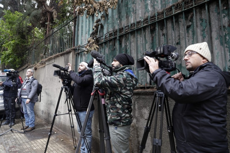 Members of the press wait in front of a house identified by court documents as belonging to former Nissan chief Carlos Ghosn in a wealthy neighborhood of the Lebanese capital Beirut on Tuesday.  -AFP
