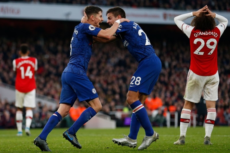 Chelsea's Italian midfielder Jorginho, left, celebrates scoring their first goal to equalize 1-1 with Chelsea's Spanish defender Cesar Azpilicueta, right, during the English Premier League football match between Arsenal and Chelsea at the Emirates Stadium in London in this Dec. 29, 2019 file photo. — AFP