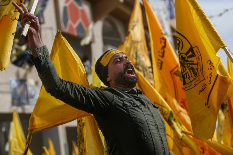 Supporters of the Palestinian Fatah movement take part in a rally marking the 55th foundation anniversary of the political party in Gaza City on Wednesday. — AFP