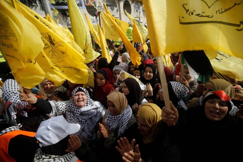 Supporters of the Palestinian Fatah movement take part in a rally marking the 55th foundation anniversary of the political party in Gaza City on Wednesday. — AFP