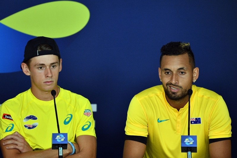 Australia's team members Alex de Minaur (L) and Nick Kyrgios attend a press conference ahead of the ATP Cup tennis tournament at the Queensland Tennis Centre in Brisbane on Thursday. — AFP