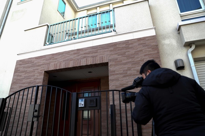 A cameraman films footage of the residence of former auto tycoon Carlos Ghosn in Tokyo on Friday, after Ghosn fled Japan to avoid a trial. Fugitive former Nissan boss Carlos Ghosn was caught on security camera leaving his Tokyo home by himself on the day he fled to avoid a Japanese trial, local media reported. — AFP