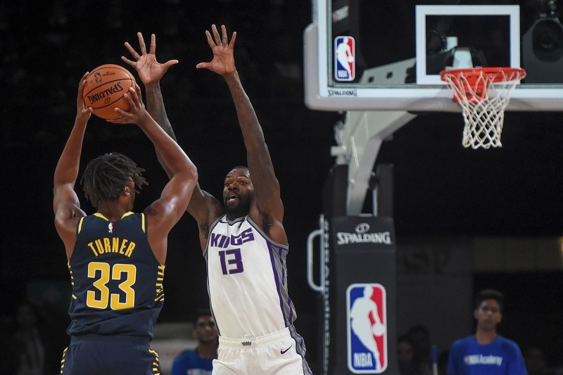 In this file photo taken on Oct. 3, 2019 Sacramento Kings player Dewayne Dedmon (R) tries to block Indiana Pacers player Myles Turner during the first pre-season NBA basketball game between Sacramento Kings and Indiana Pacers at the NSCI Dome in Mumbai. Sacramento Kings center Dewayne Dedmon was fined $50,000 by the NBA on Thursday after admitting in a newspaper interview that he wants to be traded to another club. — AFP