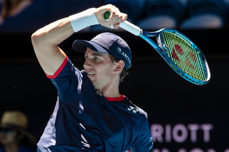 Casper Ruud of Norway hits a return against John Isner of the US during their first session men's singles match on day one of the ATP Cup tennis tournament in Perth on Friday. — AFP