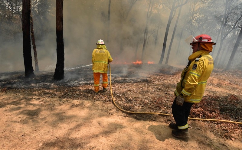 Australia's Prime Minister Scott Morrison visits a wildflower farm in an area devastated by bushfires in Sarsfield, Victoria state, on Friday. — AFP