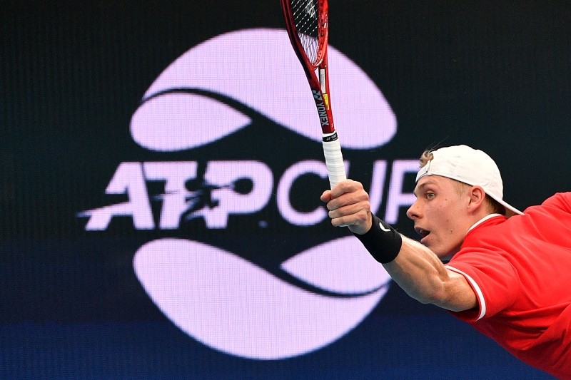 Canada's Denis Shapovalov hits a return against Greece's Stefanos Tsitsipas during their men's singles match at the ATP Cup tennis tournament in Brisbane on Friday. — AFP