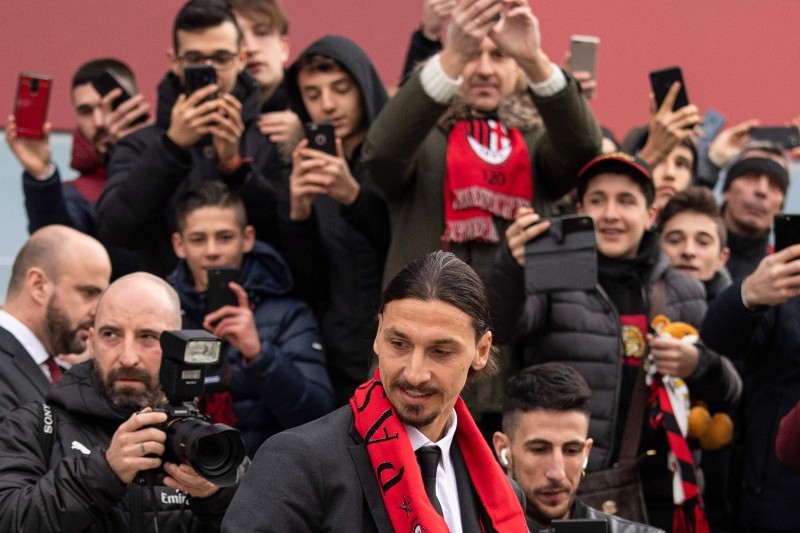 Milan's Swedish forward Zlatan Ibrahimovic looks around after receiving his new jersey during his official presentation as new AC Milan player at the club's headquarters Casa Milan in Milan on Friday. Ibrahimovic returns to the side on a six-month deal, promising to help rescue the struggling Serie A outfit's season. — AFP