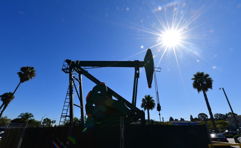 A pumpjack from California-based energy company Signal Hill Petroleum is seen in front of the landmark Curley's Cafe, one of two pumpjacks in the Diner's parking lot which has been churning out oil from the ground below since 1921 in Signal Hill, California, in this Oct. 21, 2019 file photo. — AFP