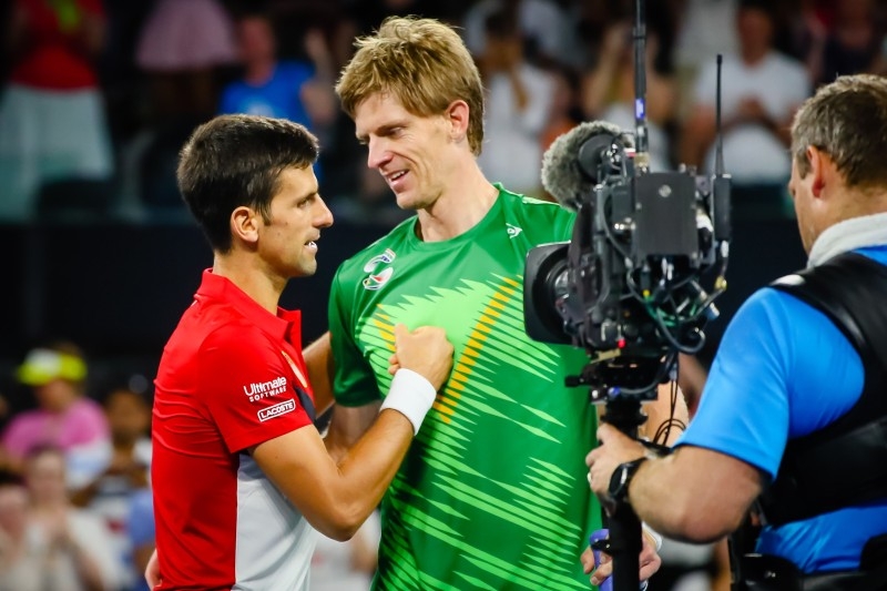 Novak Djokovic of Serbia (L) speaks with Kevin Anderson of South Africa after winning their men's singles match on day two of the ATP Cup tennis tournament in Brisbane on Saturday. — AFP