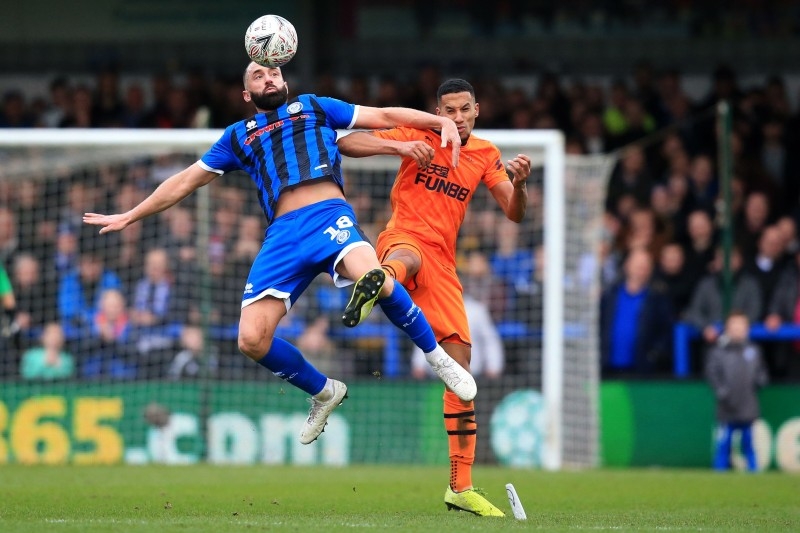 Rochdale's English striker Aaron Wilbraham (L) vies with Newcastle United's English midfielder Isaac Hayden during the English FA Cup third round football match at the Crown Oil Arena in Rochdale, north west England on Saturday. — AFP