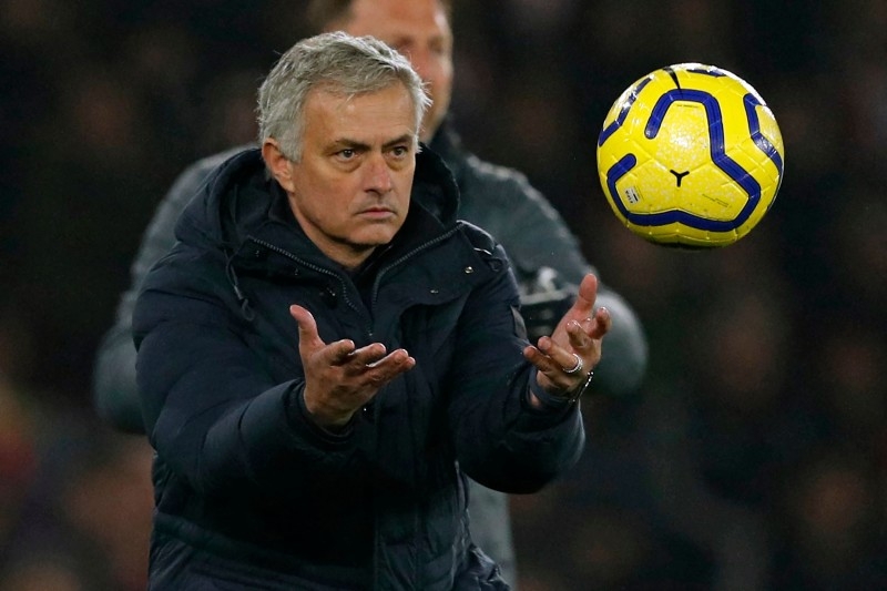 Tottenham Hotspur's Portuguese head coach Jose Mourinho returns the ball during the English Premier League football match against Southampton at St Mary's Stadium in Southampton, southern England on Jan. 1, 2020. — AFP