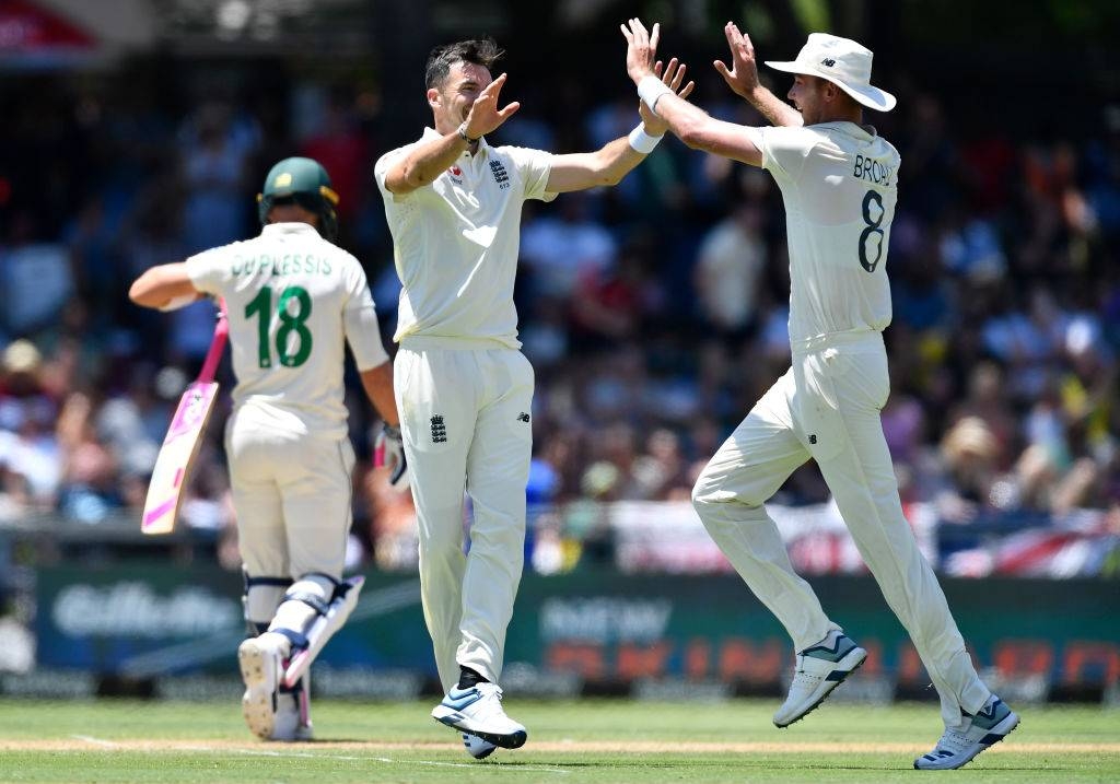 Stuart Broad, right, and James Anderso, center, led a relentless bowling performance as England restricted South Africa on the second day of the second Test at Newlands on Saturday. 