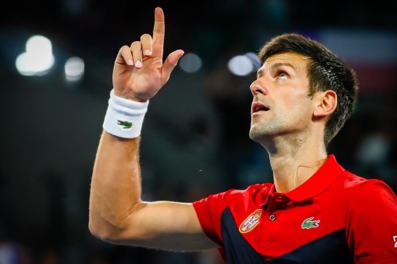 Novak Djokovic of Serbia celebrates his victory against Kevin Anderson of South Africa during their men's singles match on day two of the ATP Cup tennis tournament in Brisbane on Saturday. — AFP