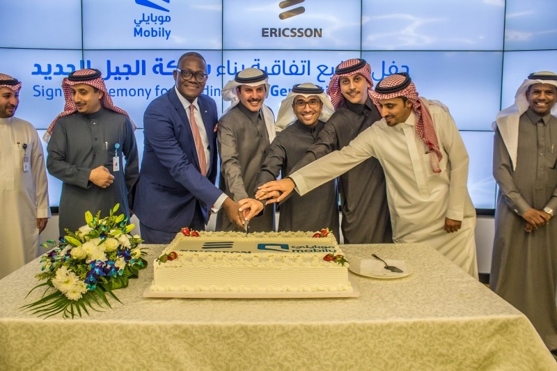 Ceremonial cutting of the cake to signify an agreement in which Mobily will be leveraging Ericsson's cutting-edge products and solutions