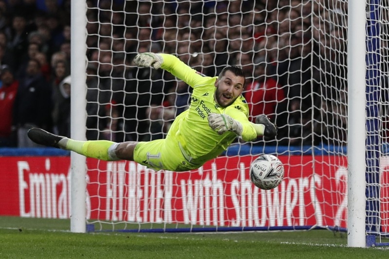 Liverpool's English midfielder Curtis Jones (L) celebrates after scoring the opening goal of the English FA Cup third round football match against Everton at Anfield in Liverpool, north west England on Sunday. — AFP