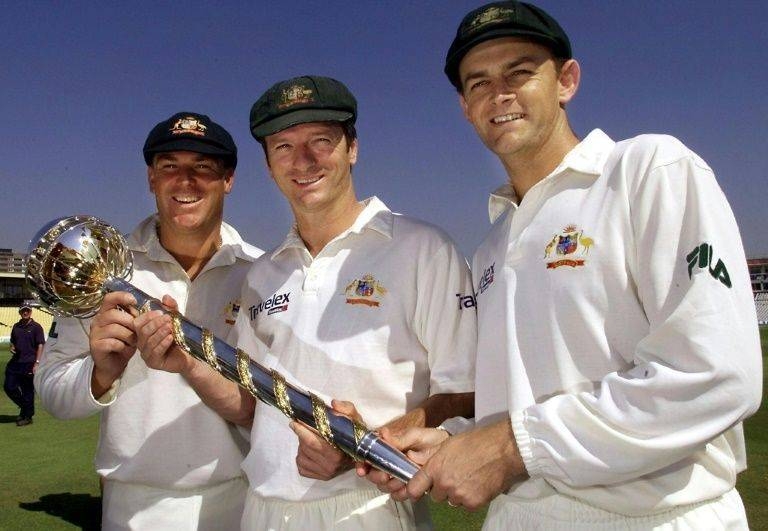 Spinner Shane Warne, pictured on the left in 2001, said he wanted to auction off his baggy green cap to help those hit by Australia's fires. — AFP