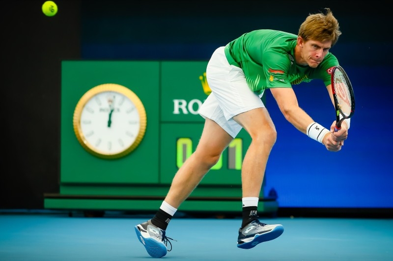 Kevin Anderson of South Africa hits a return against Cristian Garin of Chile during their men's singles match on day four of the ATP Cup tennis tournament in Brisbane on Monday. — AFP