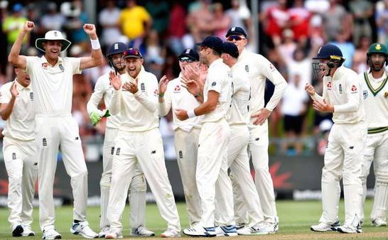 England players jubilate at the fall of Dean Elgar's wicket as South Africa faces an uphill task on the fourth day of the second Test at Newlands on Monday.