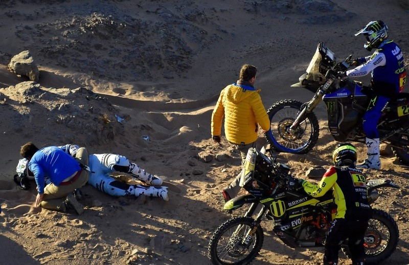 France's biker Adrien Van Beveren lies on the sand after a crash during the Stage 3 of the Dakar 2020 around Neom, Saudi Arabia, on Tuesday. — AFP